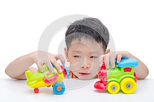 Boy playing toys over white