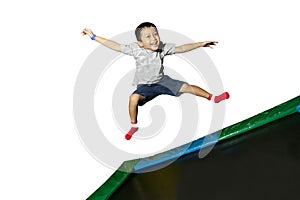 Boy playing on a trampoline