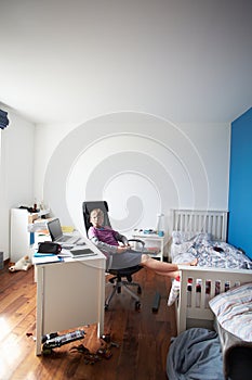 Boy Playing Video Game In Bedroom