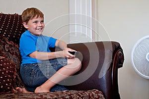 Boy playing video game on TV