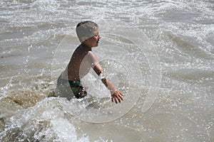 Boy Playing in Water