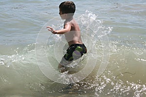 Boy Playing in Water