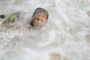 Boy Playing in Water