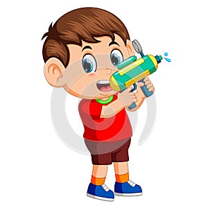 Boy playing with water gun