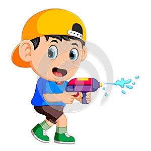 Boy playing with water gun