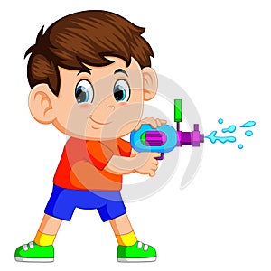 Boy playing with water gun