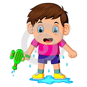 Boy playing with water gun