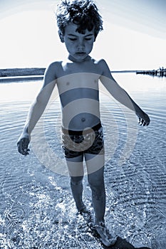 Boy playing in the water