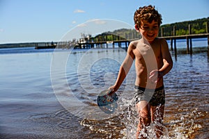 Boy playing in the water