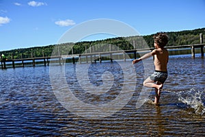 Boy playing in the water