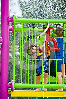 Boy playing at a waterpark.