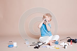 A boy plays in doctor medicine hospital