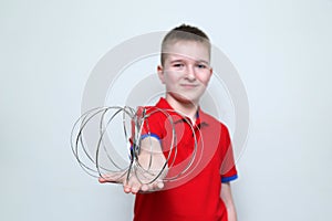 The boy plays with educational kinetic toy for children and teenagers. The development of neuroplasticity of the brain. Emotions