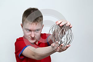 The boy plays with educational kinetic toy for children and teenagers. The development of neuroplasticity of the brain. Emotions
