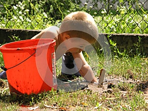 Boy plays in the garden