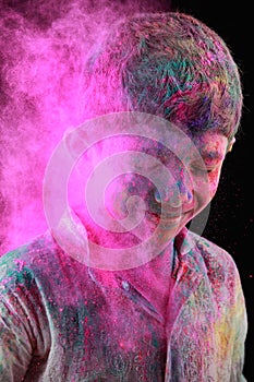 A boy plays Holi