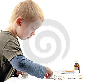 Boy plays pills