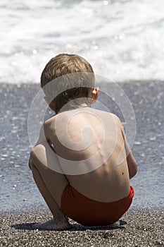 Boy plays at the seaside