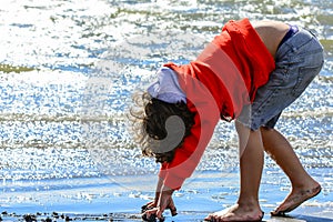 Boy plays at the seaside