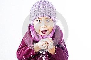 Boy plays snow in winter isolated over white