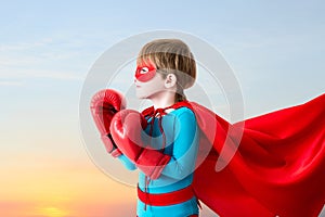 Boy plays super hero.