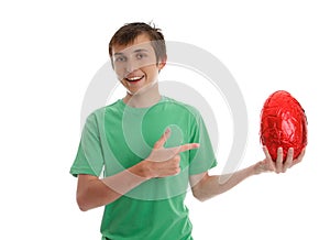 Boy pointing to an easter egg
