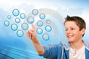 Boy pointing at virtual web icons.