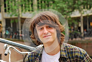 Boy portrait, 16 years old teenager with long hair