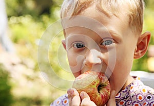 Boy portrait with apple
