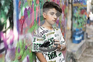 Boy portrait with grafiti behind