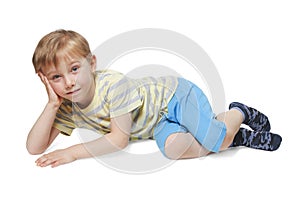 Boy posing while lying down