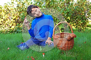 Boy posing with mushrooms