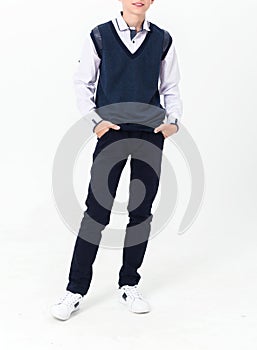 Boy posing in school uniform on white background