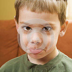 Boy pouting.