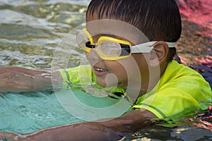 Boy Practice Swimming. Activities on the pool, children swimming