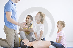 Boy practicing first aid