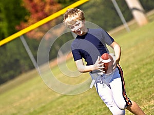 Boy Practicing Football