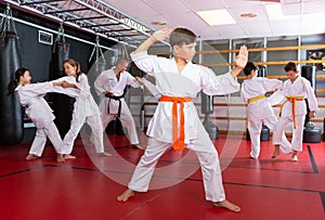 Boy practicing new moves during karate class