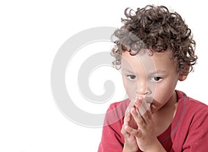 Boy praying to God stock photo