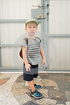 Boy prepares to leave his house