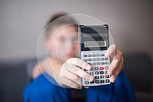 Boy presenting calculator