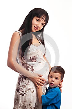 Boy pressed against her stomach pregnant momt