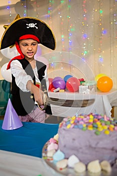 Boy pretending to be as pirate during birthday party