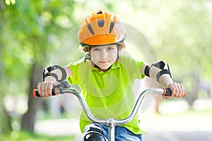 The boy in the protective helmet for bike