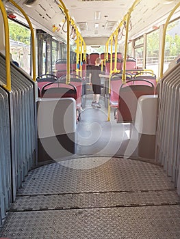 Boy in a public transport. Cute boy standing in empty schoolbus