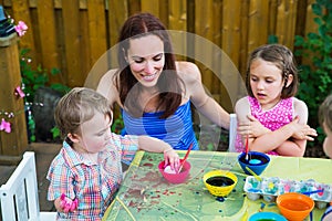 Boy Puts Easter Egg in Pink Dye