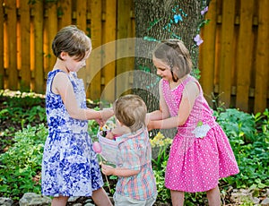 Boy Puts Egg in Girl's Easter Basket