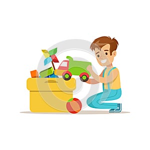 Boy Putting His Toys In Special Box Smiling Cartoon Kid Character Helping With Housekeeping And Doing House Cleanup