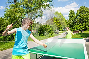 Boy with racket ready to play in table tennis