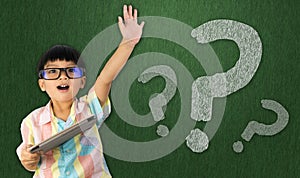 Boy raise his hand to ask question